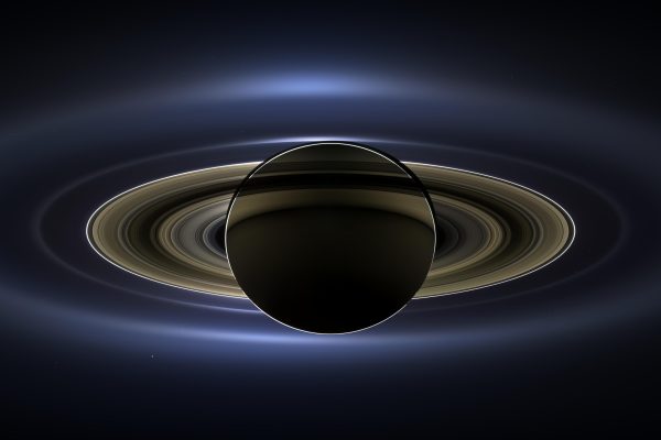 as seen by Cassini in 2013. Earth can be seen as a few bright pixels below the right hand side of the rings.