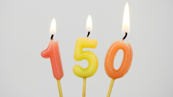 Lit candles mark a 150th birthday.