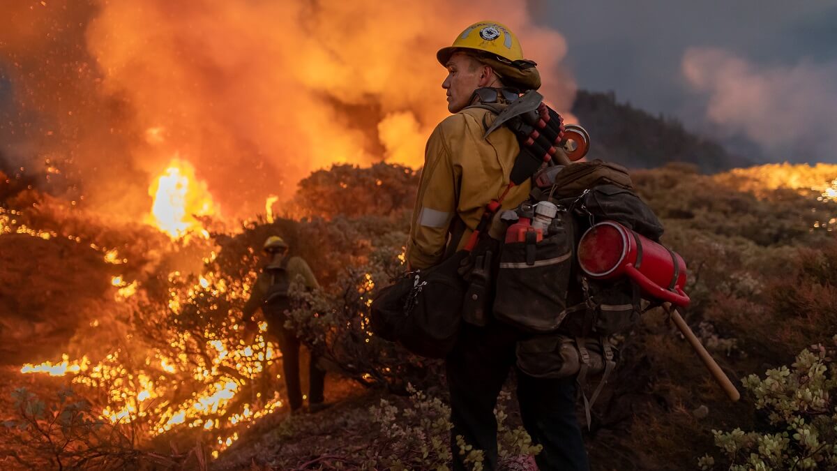 wildfires and thunderstorms: complex interconnections spawned by climate change 1 Firefighters descend a hill towards a fire