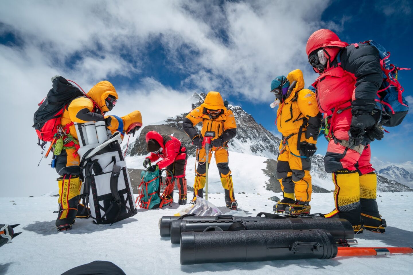 Mariusz Potocki and Sherpa team drilling the highest ice core ever recovered at 8020m elevation with the summit of Mount Everest in the background. Dirk Collins NatGe