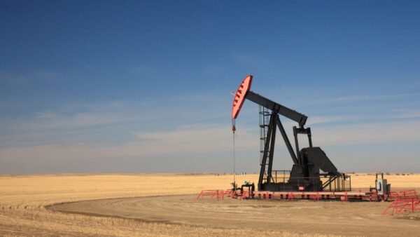 fracking in alberta concept an oil pump jack in a field