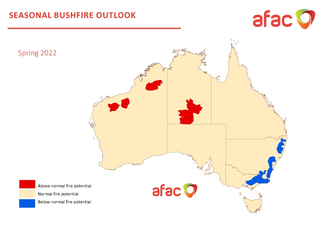 Seasonal bushfire outlook map of Australia's spring bushfire risk. Shows a light brown map of Australia with blue regions highlighted along its eastern coast, with red highlighted patches in central and north-western regions.