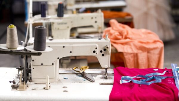 sewing maching in a garment factory, part of the fashion supply chain