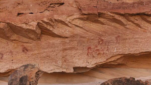 lines, ocre hands and other rock art visible at marra wonga