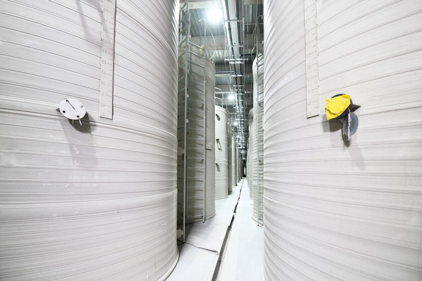large white tanks, several metres high, containing flow battery electrolytes