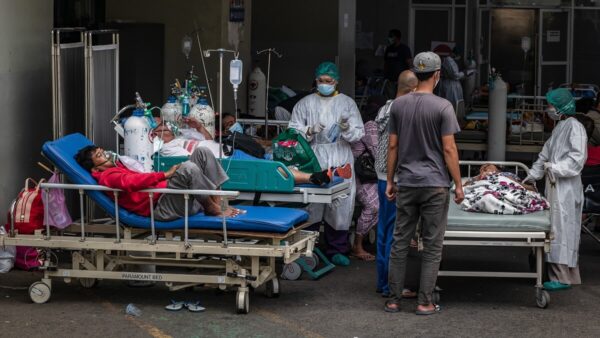 Patients got treatment outside an emergency room due to an overflow of Covid-19 patients at a hospital on July 2, 2021 in Semarang, Central Java, Indonesia.