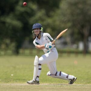 Girl playing cricket