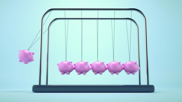 newton's cradle with piggy banks, representing science funding