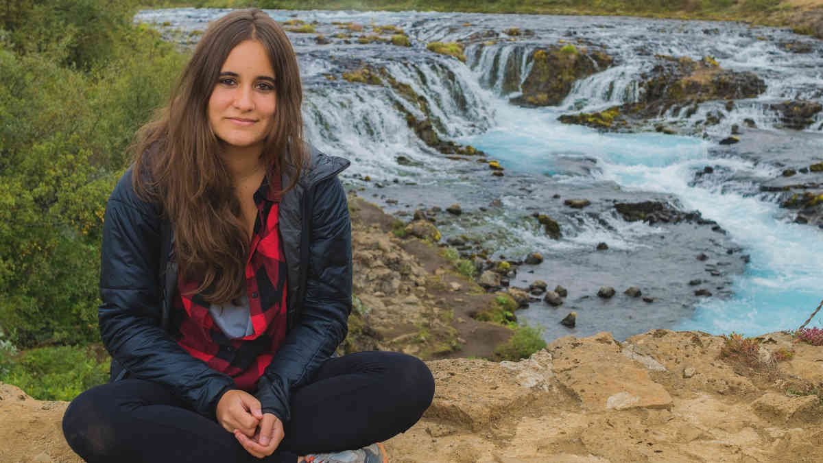dr-nuria-jordana-mitjans-sitting-by-waterfall
