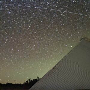 Sky trail left by BlueWalker 3 over McMath-Pierce Solar Telescope.