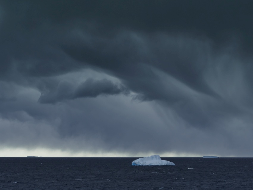 Iceberg beneath Stormy Sky