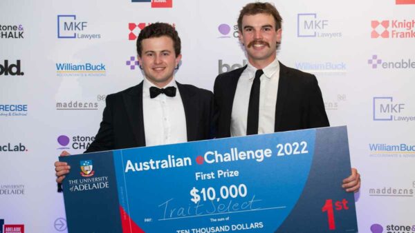 Hector Mackenzie and Tom Gameau holding a cheque for $10,000 for the smartphone app Trait Select