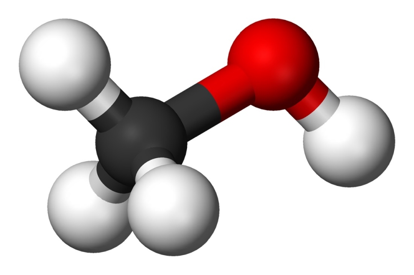 methanol molecule: black ball connected to a red ball, black ball has three white balls connected to it and red ball has one white ball connected to it
