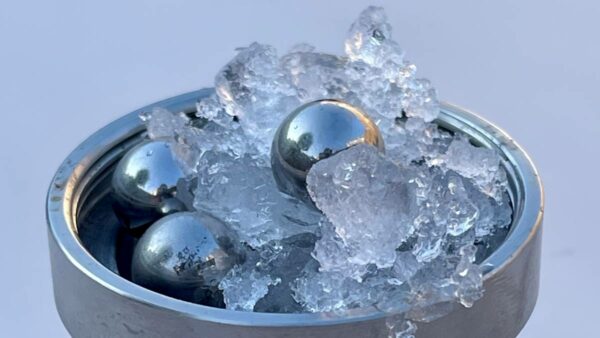 Normal ice, steel balls, inside a tumbler